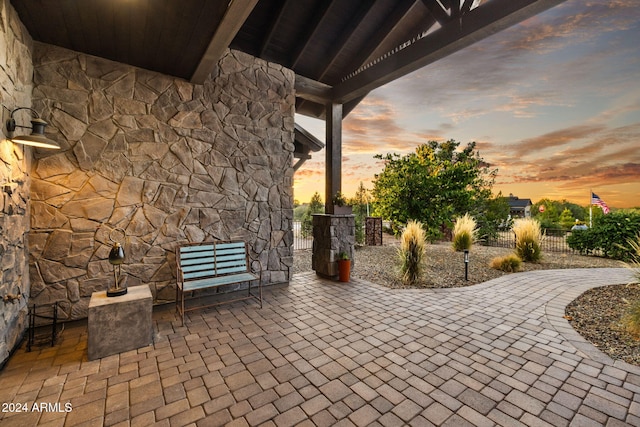 view of patio terrace at dusk