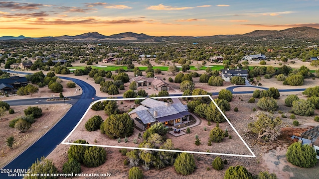 aerial view at dusk with a mountain view