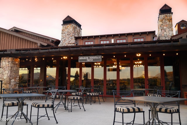 view of patio terrace at dusk