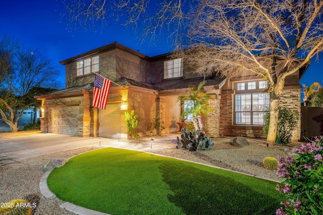 view of front of house with an attached garage, brick siding, and driveway