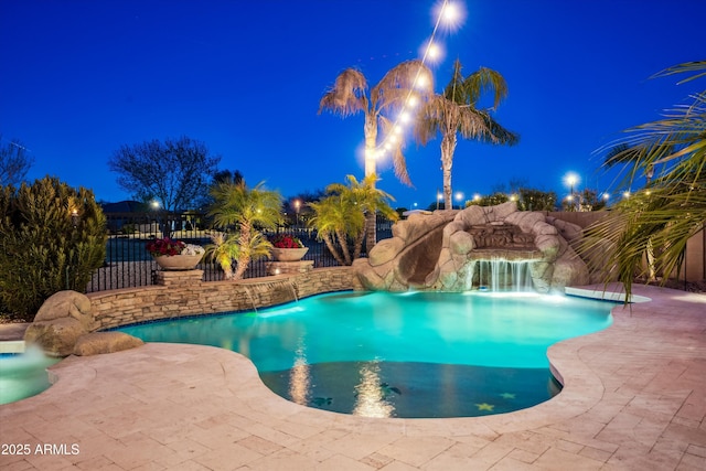 pool at twilight with a fenced in pool, a patio, and fence