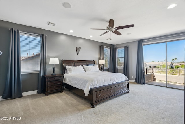 bedroom with access to exterior, visible vents, baseboards, and carpet floors