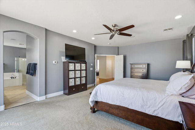 bedroom featuring visible vents, recessed lighting, arched walkways, carpet flooring, and baseboards