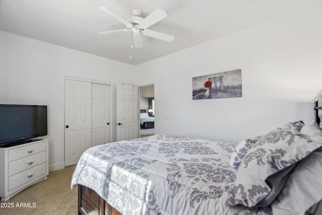 bedroom with a closet, light colored carpet, and ceiling fan