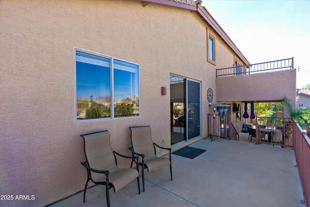 view of patio with a balcony