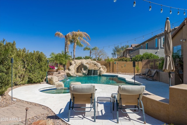 view of pool featuring a fenced in pool, a patio, and fence