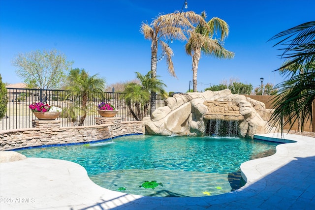 view of swimming pool with a fenced in pool and fence