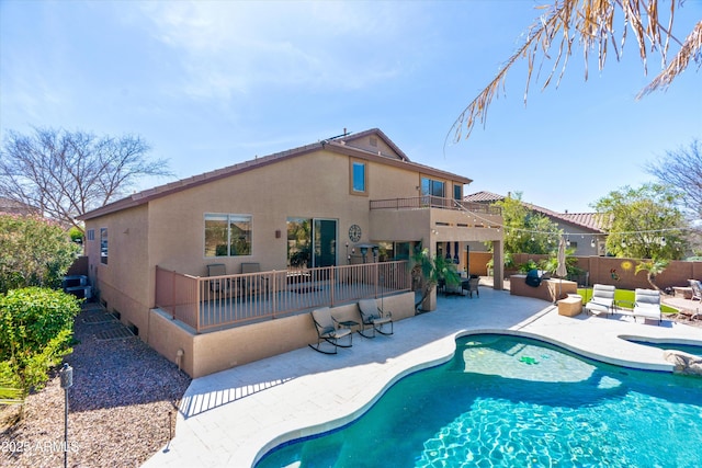 view of pool featuring a patio area, a fenced in pool, an in ground hot tub, and a fenced backyard