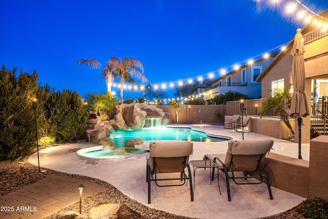 view of pool with a patio, fence, a fenced in pool, and a water slide