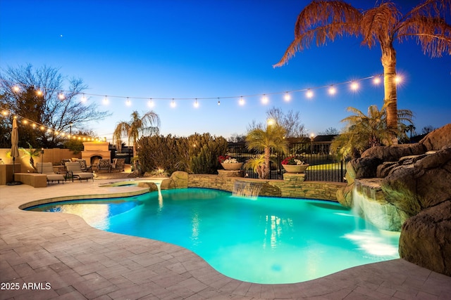 pool at dusk with a fenced in pool, fence, outdoor dry bar, and a patio area