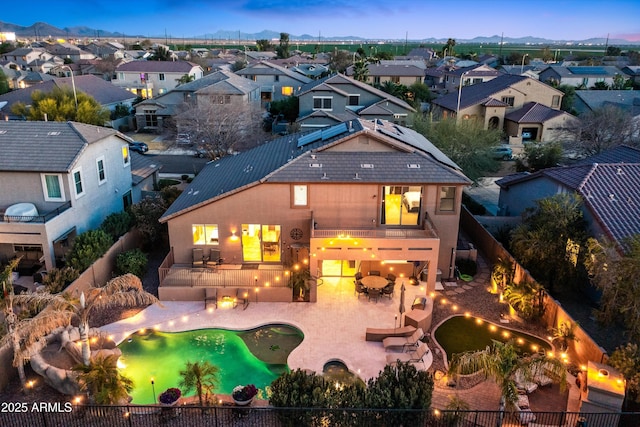 back of house featuring a residential view, a patio, and a fenced backyard