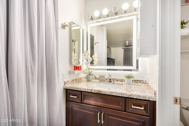 full bath with toilet and vanity