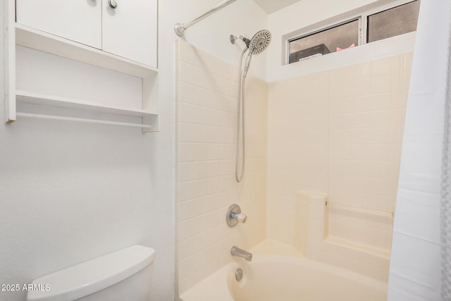 bathroom featuring toilet and washtub / shower combination