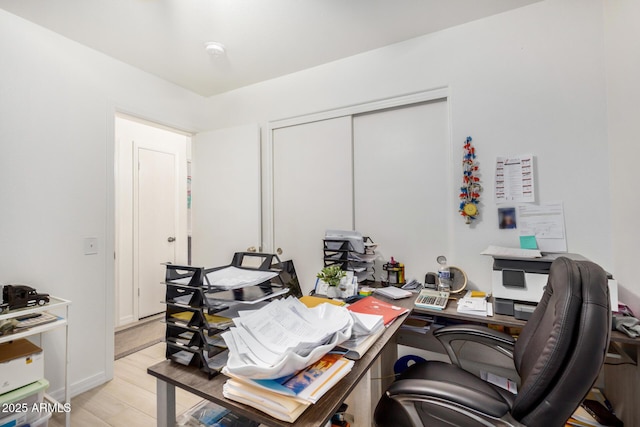 office space with light wood-type flooring