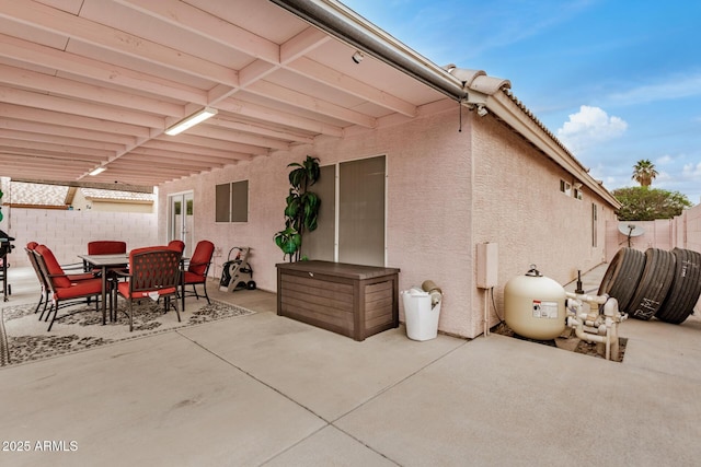 view of patio featuring outdoor dining space and a fenced backyard