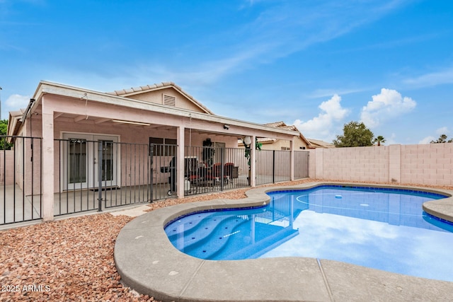 view of pool with a fenced in pool, a patio area, and a fenced backyard