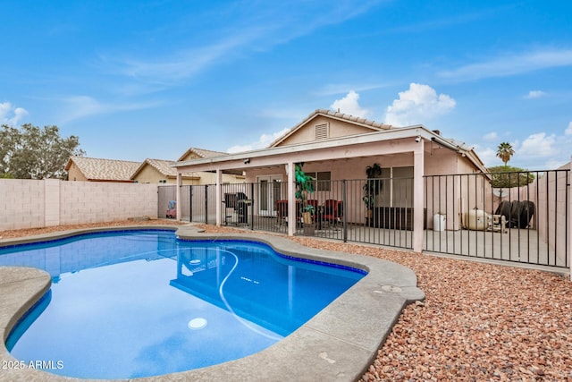 view of pool with a fenced in pool, a patio area, and a fenced backyard