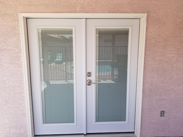 doorway to property with stucco siding