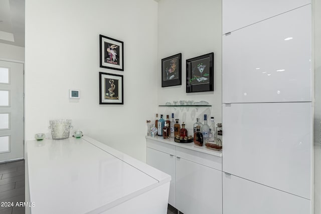 bar featuring white cabinetry