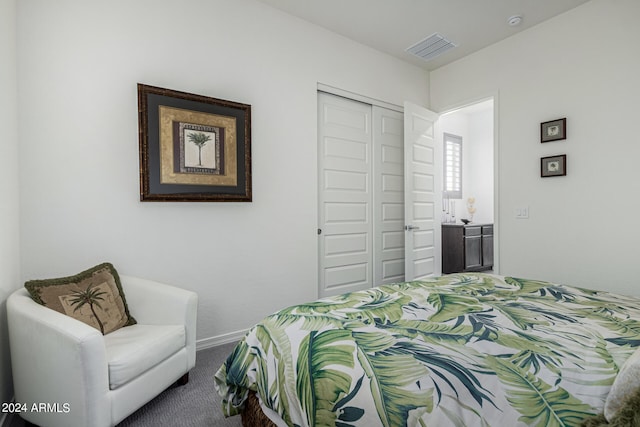 carpeted bedroom with a closet