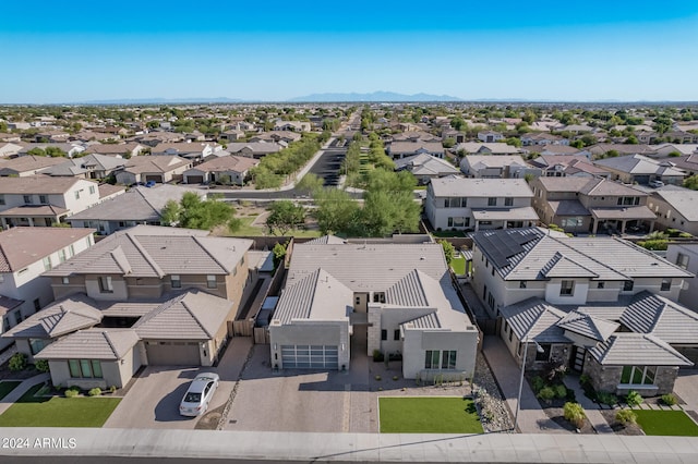 birds eye view of property with a mountain view