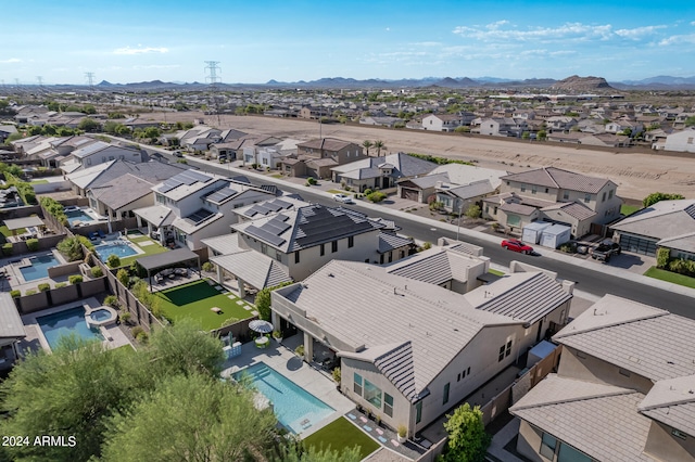 birds eye view of property with a mountain view