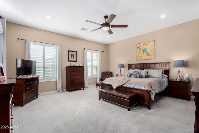 bedroom featuring light carpet and ceiling fan