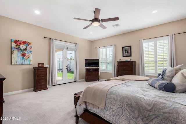 carpeted bedroom with access to exterior, ceiling fan, and french doors