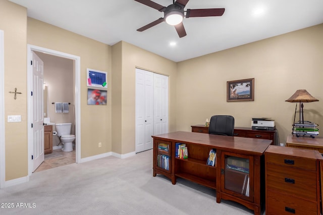 office with light colored carpet and ceiling fan