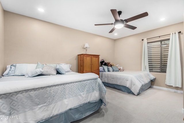 carpeted bedroom featuring ceiling fan