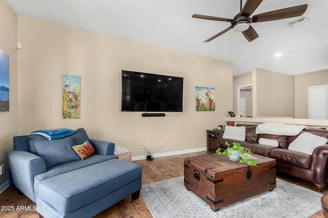 living room with hardwood / wood-style flooring and ceiling fan