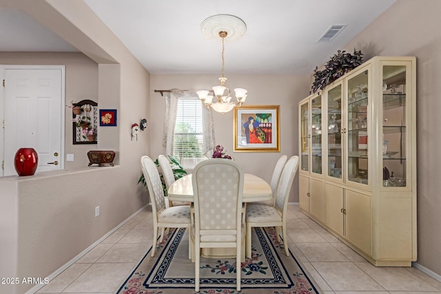 19722 N Regents Park Dr, Surprise, AZ 85387 - dining room with a chandelier, light tile patterned floors, and baseboards