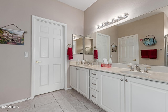 19722 N Regents Park Dr, Surprise, AZ 85387 - bathroom featuring double vanity, tile patterned floors, and baseboards