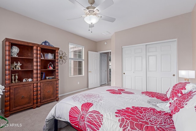 19722 N Regents Park Dr, Surprise, AZ 85387 - carpeted bedroom with a closet, baseboards, and a ceiling fan