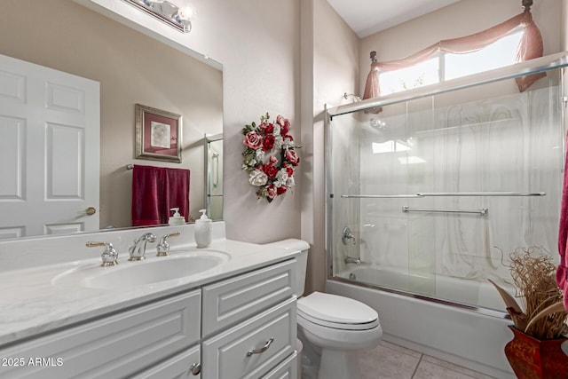 19722 N Regents Park Dr, Surprise, AZ 85387 - bathroom with vanity, toilet, tile patterned floors, and bath / shower combo with glass door