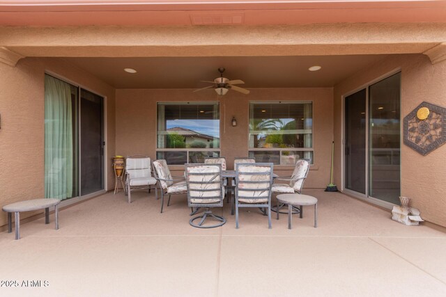 19722 N Regents Park Dr, Surprise, AZ 85387 - view of patio / terrace featuring ceiling fan and outdoor dining space