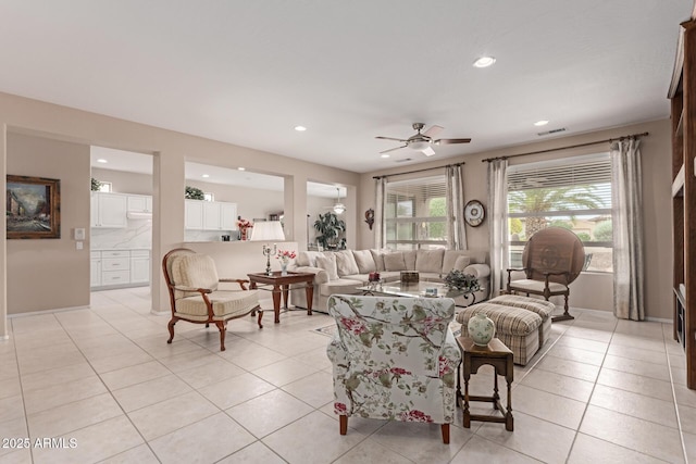 19722 N Regents Park Dr, Surprise, AZ 85387 - living room with a ceiling fan, recessed lighting, and light tile patterned flooring