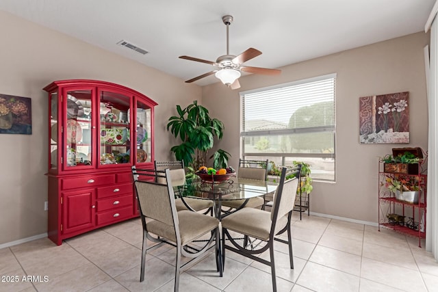 19722 N Regents Park Dr, Surprise, AZ 85387 - dining room with a ceiling fan, light tile patterned floors, and baseboards