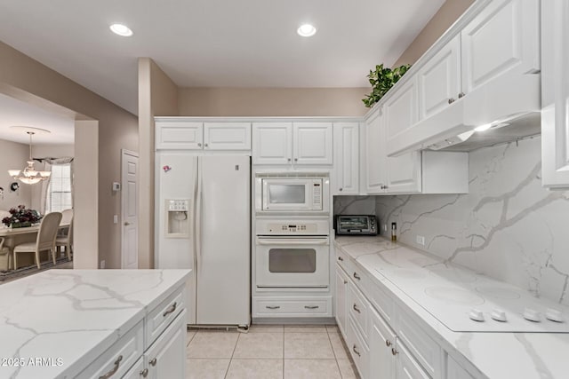 19722 N Regents Park Dr, Surprise, AZ 85387 - kitchen featuring white appliances, under cabinet range hood, white cabinets, a chandelier, and recessed lighting