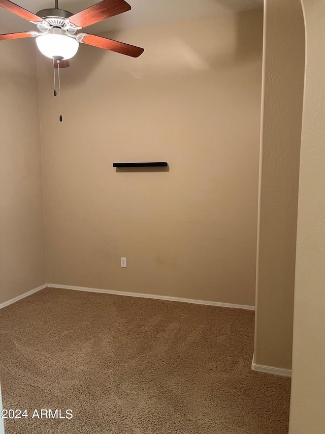 empty room with carpet floors and ceiling fan