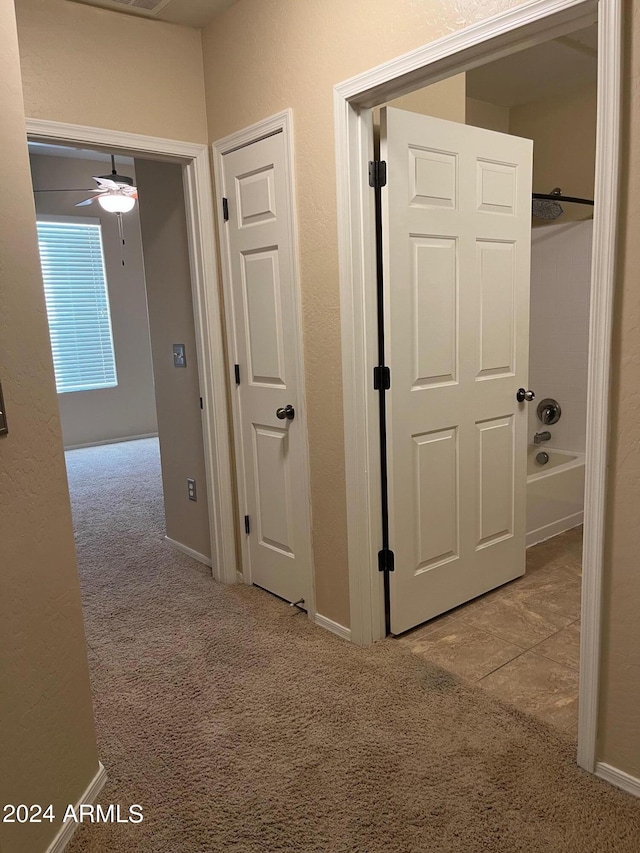 corridor with light colored carpet