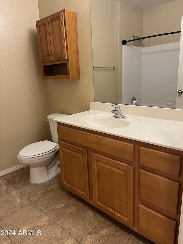 bathroom featuring toilet and vanity