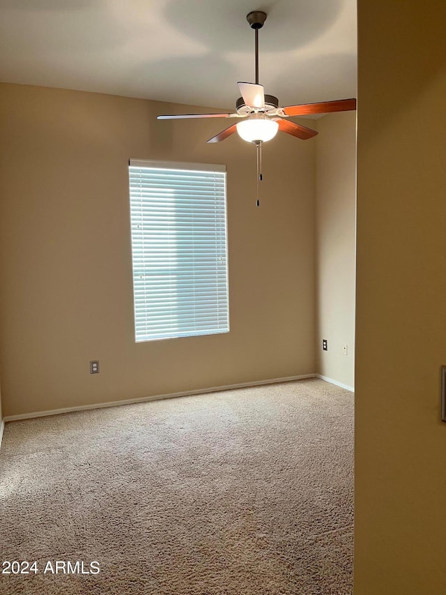 carpeted empty room with ceiling fan