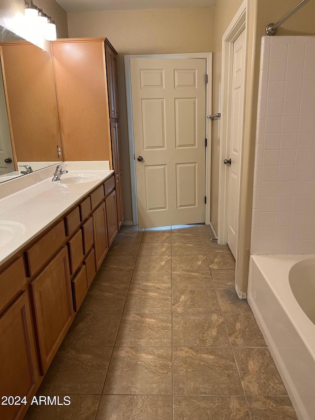 bathroom with shower / bathtub combination and vanity