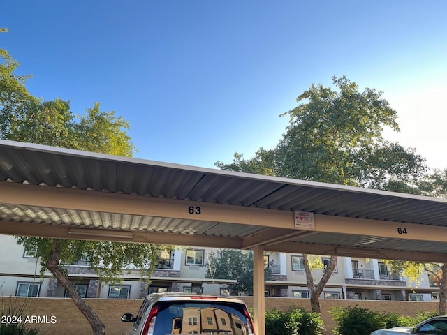 view of vehicle parking featuring a carport