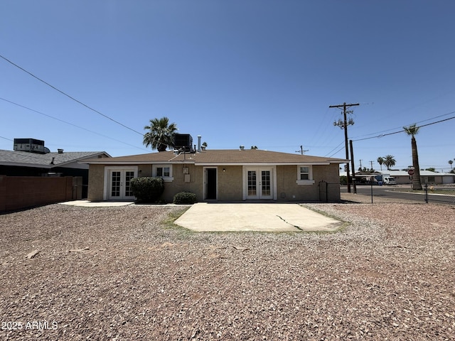 back of house featuring central AC, a patio area, french doors, and fence
