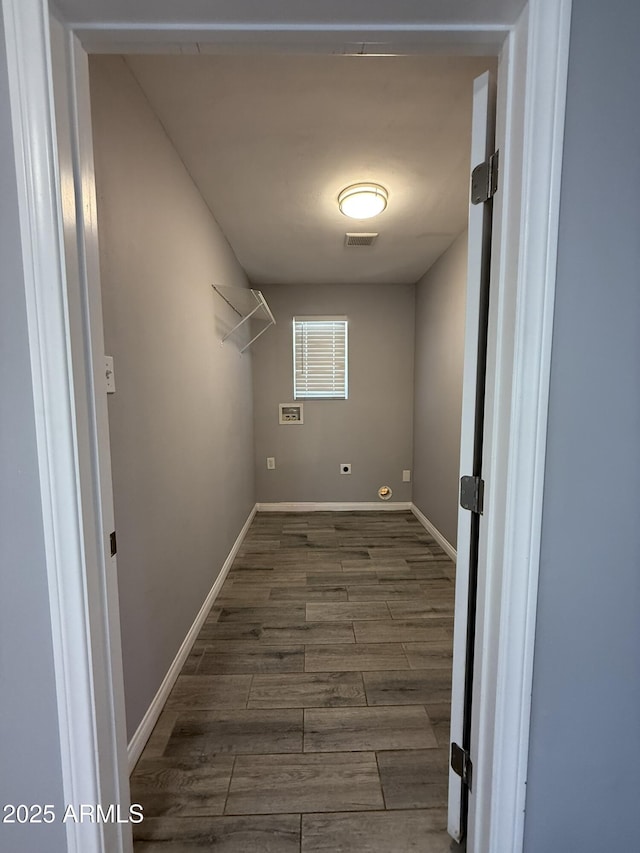 spacious closet featuring visible vents and wood finished floors