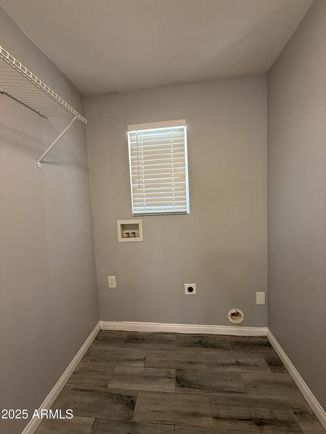 clothes washing area featuring laundry area, dark wood finished floors, electric dryer hookup, baseboards, and hookup for a washing machine