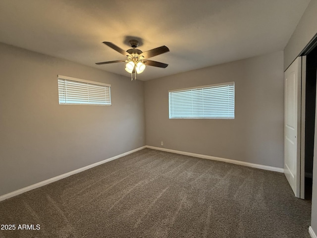 unfurnished bedroom featuring carpet flooring, a closet, baseboards, and ceiling fan