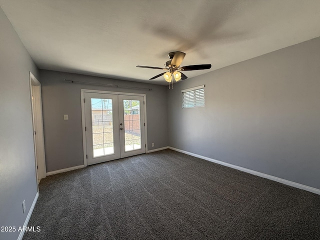 carpeted spare room with french doors, baseboards, and ceiling fan